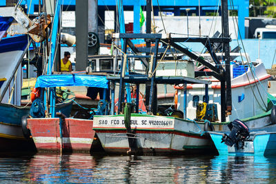 Fishing boats moored at harbor