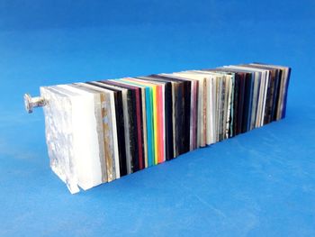 Stack of books against blue background