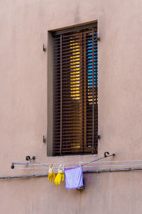 Clothes drying on wall against building