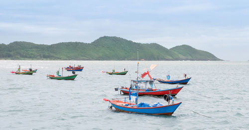 Many fishing boats are catching fish for sale at the seafood market, view fishing boats at the port.