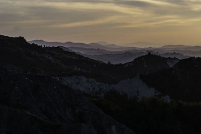 Scenic view of mountains against sky during sunset