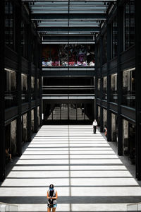 Rear view of man walking on steps