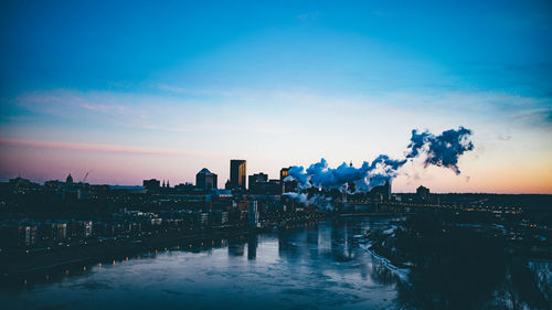 Panoramic shot of buildings against sky during sunset