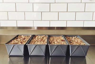 Close-up of fresh baked dessert in containers on tray