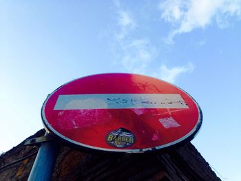 Low angle view of road sign against clear sky