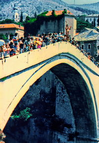 High angle view of people on bridge in city