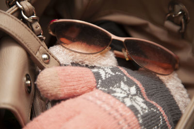 Close-up of sunglasses on shoes