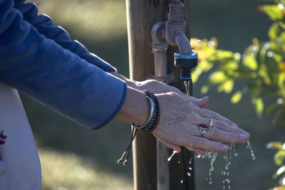 Close-up of hand holding water