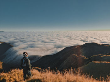 Man standing on land against clear sky