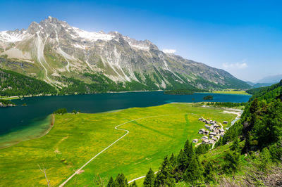 Upper engadine, lake sils, and the village of isola, photographed from above in summer.