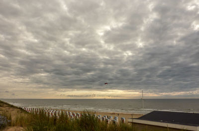 Scenic view of sea against cloudy sky