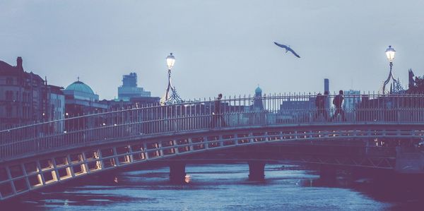 View of bridge over river in city