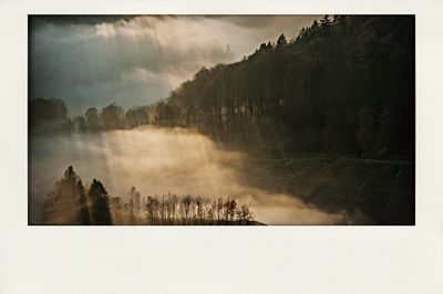 Scenic view of landscape against cloudy sky