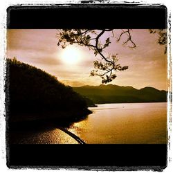 Scenic view of lake at sunset