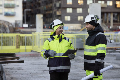 Construction engineers working at construction site