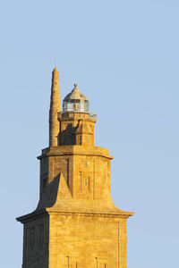 Low angle view of bell tower against sky