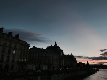 Panoramic view of city against sky at sunset