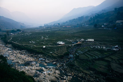 High angle view of agricultural landscape against sky