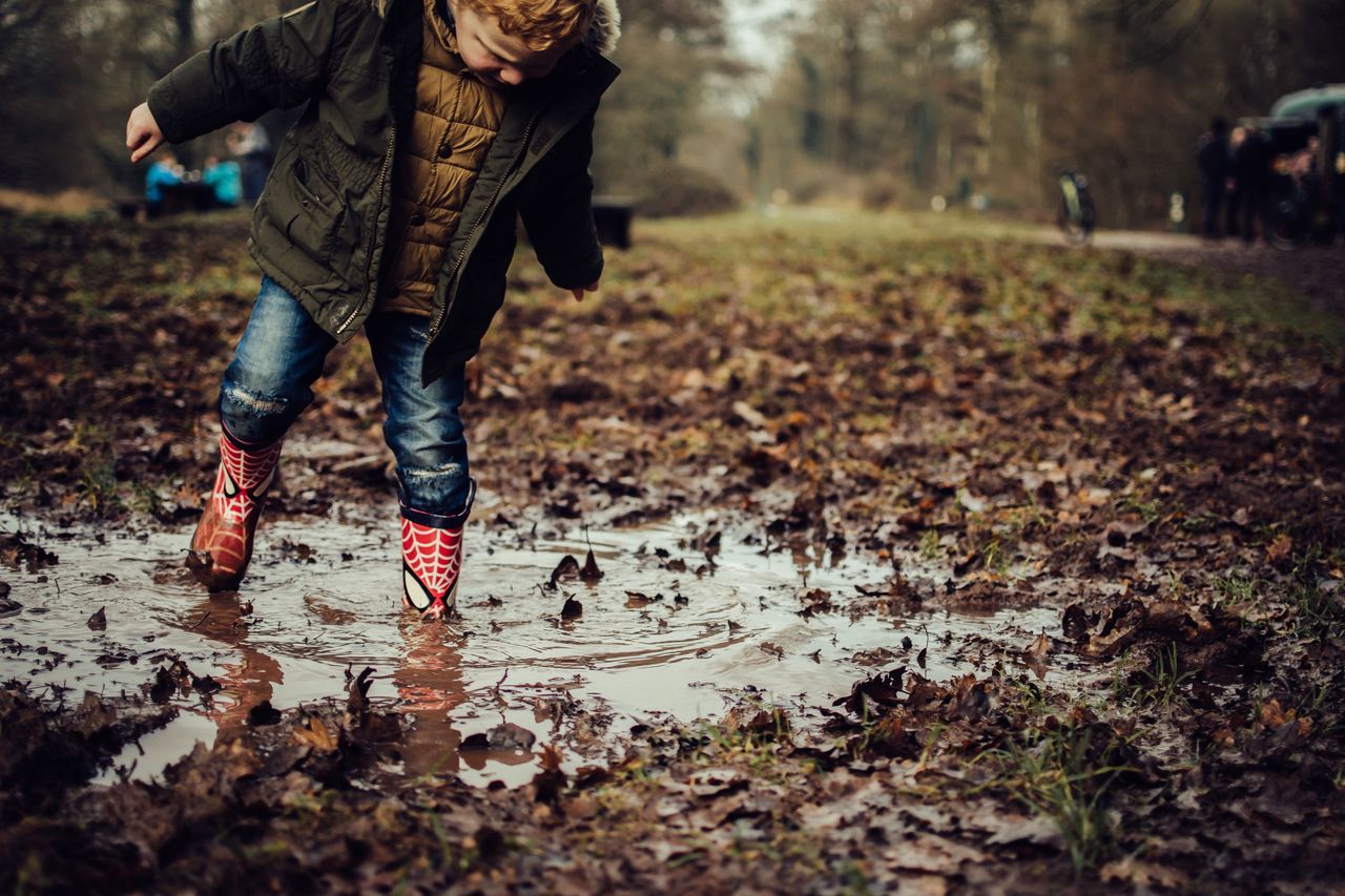 autumn, one person, shoe, leaf, low section, real people, day, outdoors, casual clothing, human leg, tree, puddle, nature, human body part, lifestyles, full length, cold temperature, warm clothing, adult, people