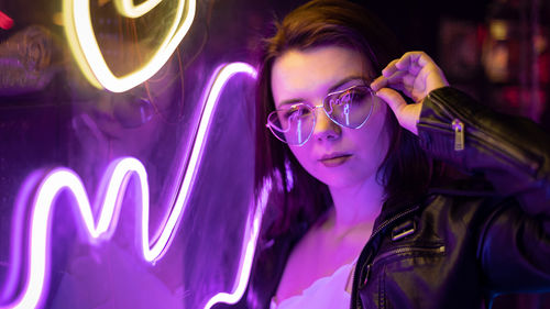 Portrait of young woman wearing sunglasses