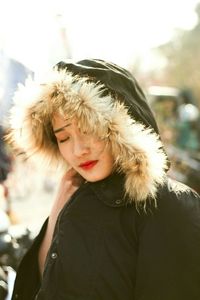 Close-up portrait of woman in snow