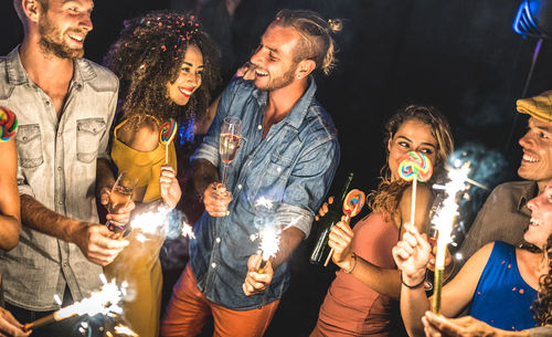 Group of people enjoying at night