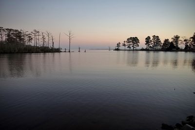 Scenic view of lake against sky during sunset