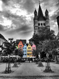 Buildings against cloudy sky