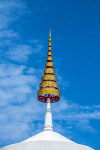 Low angle view of bell tower against blue sky