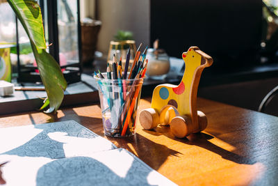 Close-up of toys on table at home