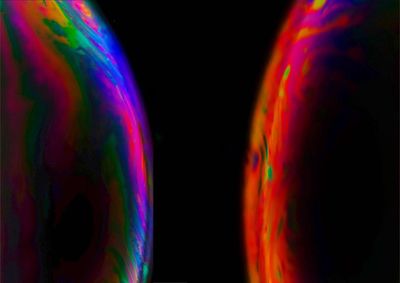 Close-up of rainbow over black background