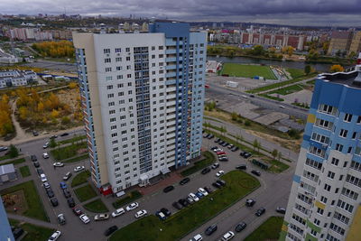 Metropolis. large apartment buildings in the city by the river.