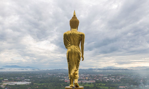 Low angle view of statue against sky