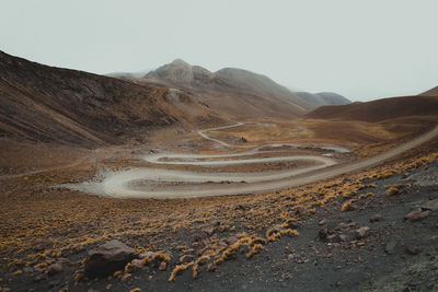 Road through the mountains and clouds