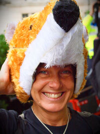 Portrait of smiling woman wearing hat