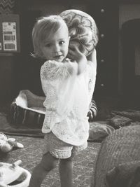 Portrait of cute boy holding toy