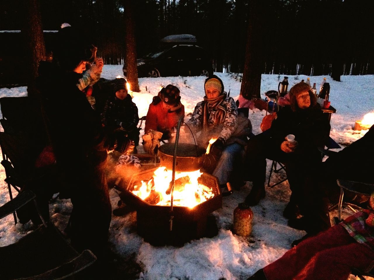 flame, burning, fire - natural phenomenon, heat - temperature, orange color, firewood, sunlight, outdoors, tree, bonfire, fire, sunset, men, togetherness, standing, lifestyles, nature, field, sitting