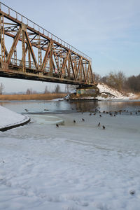 Bridge over river against sky
