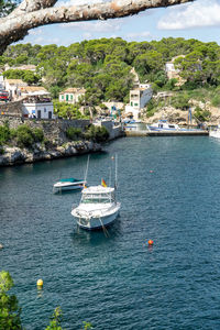 High angle view of sea by buildings in city