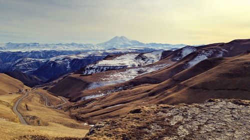 Aerial view of snowcapped mountains against sky