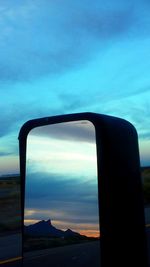 Scenic view of landscape against sky at sunset