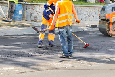 Rear view of man working at construction site