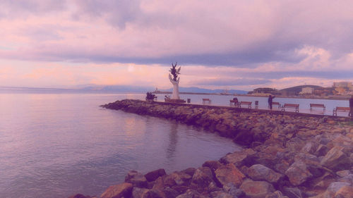 Scenic view of sea against sky at sunset