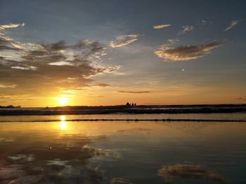 Scenic view of sea against sky at sunset