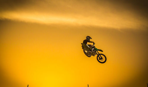 Motocross rider flying during practice session in kuwait. 