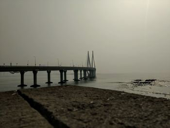 Pier over sea against sky