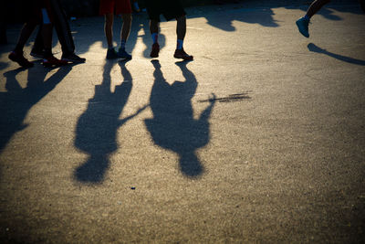 Low section of people standing on tiled floor