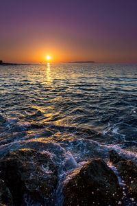 Scenic view of sea against clear sky during sunset