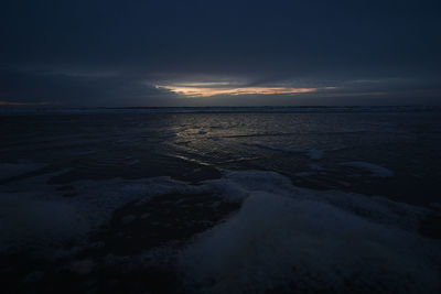 Scenic view of sea against sky at night