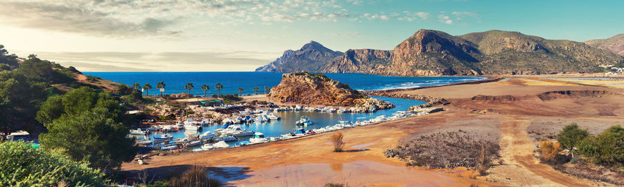 Panoramic view of harbor against sky